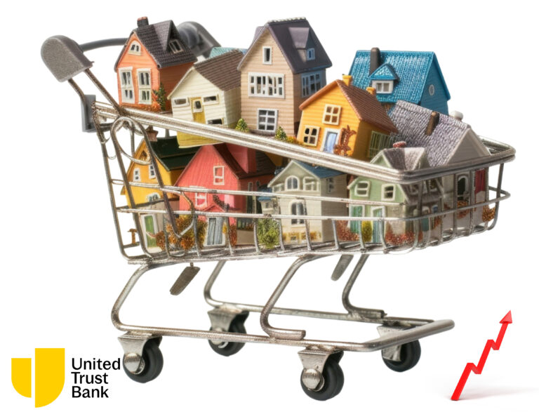 Shopping cart filled with model houses symbolising growing property portfolios.