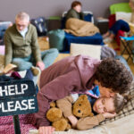 Family in temporary shelter seeking housing support during crisis