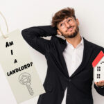 Man holding model house with tag asking “Am I a landlord?” representing rent-free property arrangement.