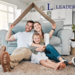 Happy family sitting together in their home symbolizing good landlord-tenant relationships