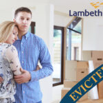 Couple facing eviction in Lambeth housing crisis with moving boxes in background