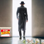 Landlord walking away after selling property, symbolizing UK housing crisis.