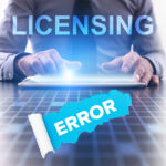 Businessman facing licensing error message on digital tablet