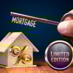 Key labeled mortgage with house model, percentage sign, and limited edition badge.
