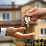 Keys being handed over in front of a house, symbolizing loss of rental homes for temporary housing.