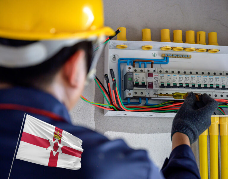 Electrician carrying out wiring inspection under new Northern Ireland landlord safety regulations