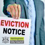 Man holding Nottingham City Council eviction notice highlighting tenant eviction issue