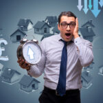 Shocked man holding clock with rising arrow amid house price and rent market symbols