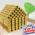 Gold bar house symbolizing high housing costs with unaffordable sign
