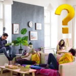 Students in shared house discussing changes to HMO tenancy agreement