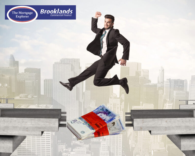 Businessman jumping over money stack symbolizing short-term lending solutions