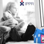 Child in worn socks holding teddy bear, highlighting housing poverty and rent affordability crisis