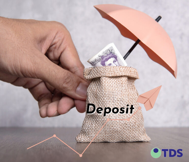 Hand placing money in a deposit bag under an umbrella symbolising deposit protection