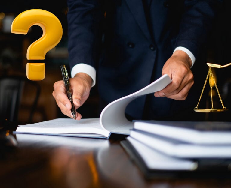 Lawyer reviewing legal documents with question mark and justice scales in background