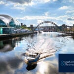 Boat on the River Tyne with Newcastle’s Sage Gateshead and Tyne Bridge in view