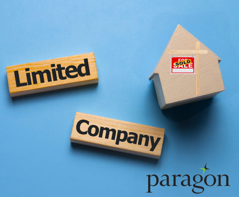 Wooden blocks reading “Limited Company” beside a house model with a sold sign, symbolising property investment.