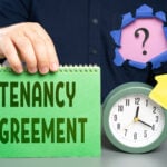 A person holding a calender saying tenancy agreement, a alarm clock, an arrow pointing upwards, and a question mark
