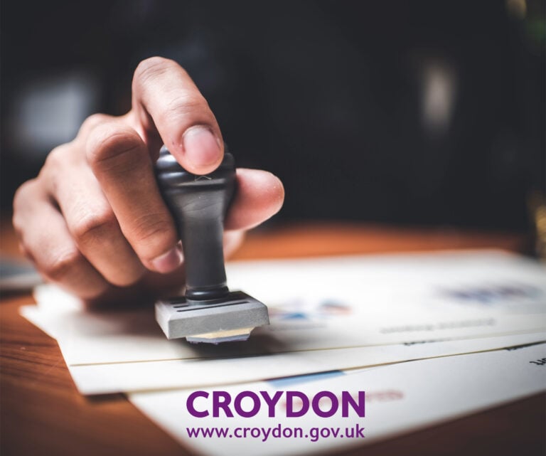 Croydon Council official stamping documents for housing regulation