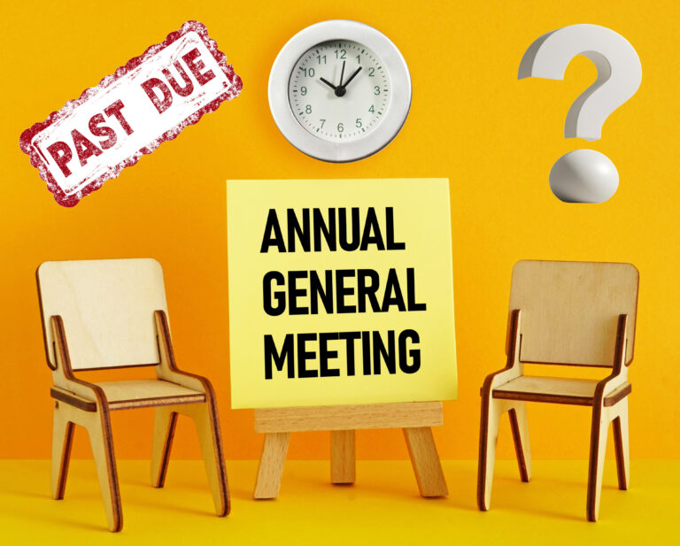 two chairs, annual general meeting, and past due sign, a clock and a question mark