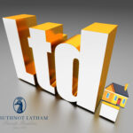 LTD company sign and a small house