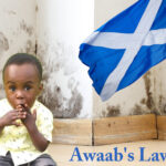 A small child, Awaab's Law logo and a Scottish Flag