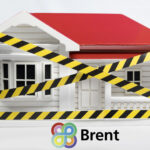 A home with yellow and balck tape around