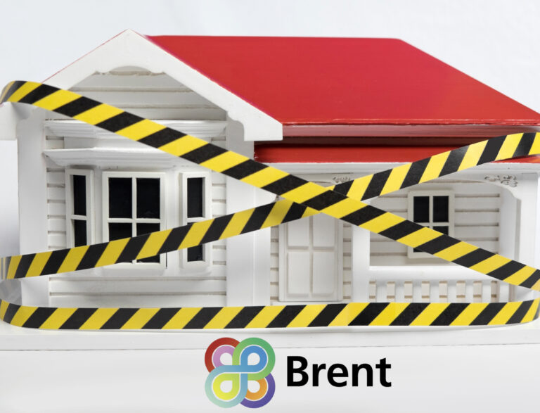 A home with yellow and balck tape around