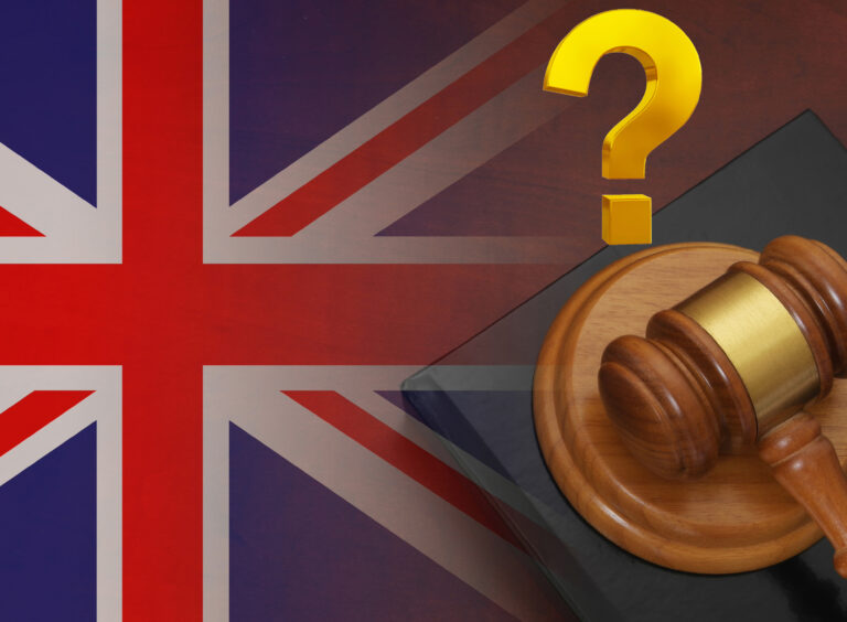 A union Jack flag, Justice hammer and a question mark