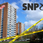 A tower block with a do not cross line, SNP logo