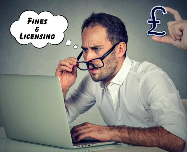 A man sitting at a laptop looking confused, fines and licencesing in a word bubble and a pound sign
