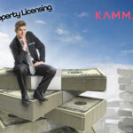 A man sitting on wads of money notes, Kamma logo