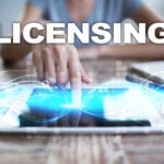 A person touching a ipad with digitial images coming out of the ipad and Licensing logo