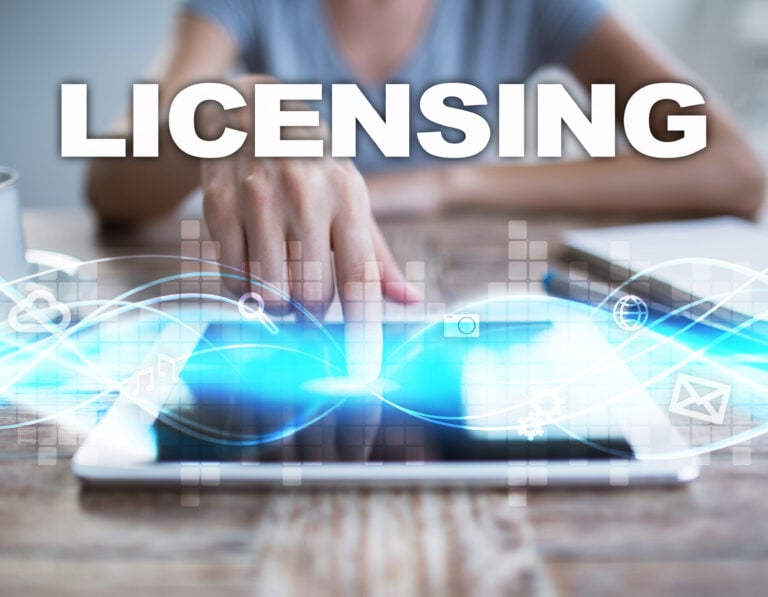 A person touching a ipad with digitial images coming out of the ipad and Licensing logo