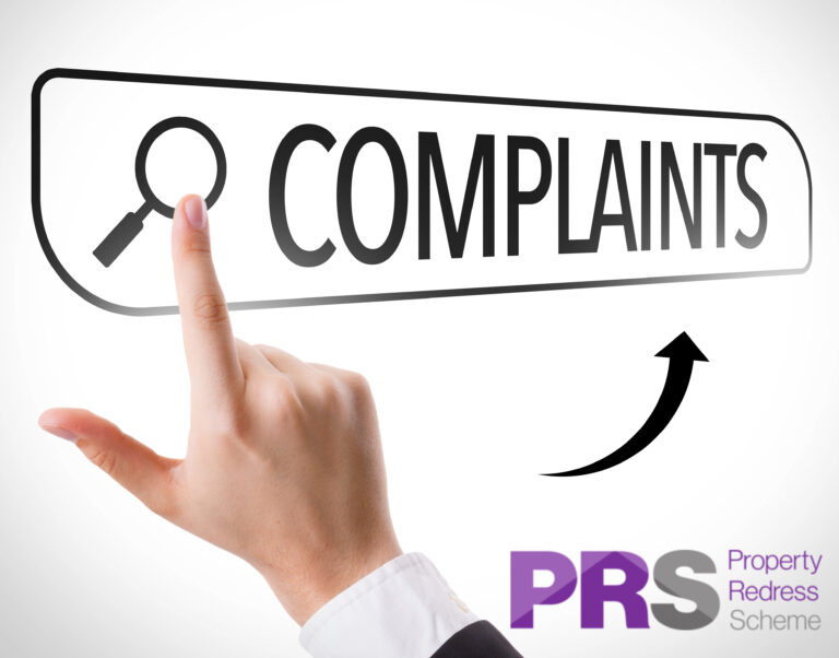 A hand pressing a complaints screen, PRS logo