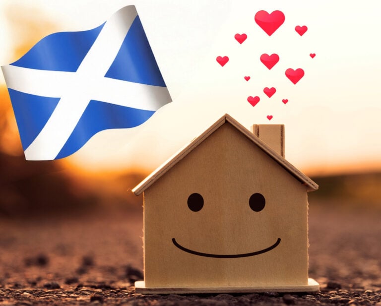 Scottish flag, a wooden house with a face smiling and hearts floating our of the chimley