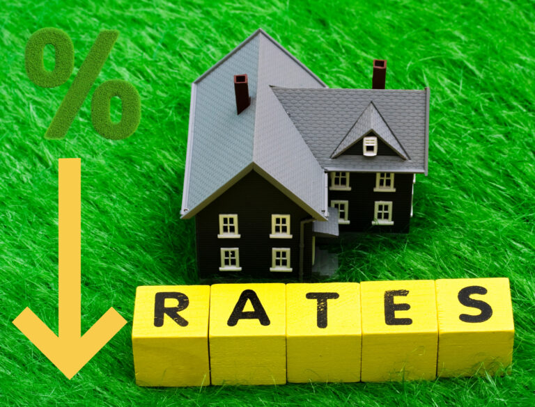 Arrow pointing down next to a house, rates and a percentage sign on a green grass background