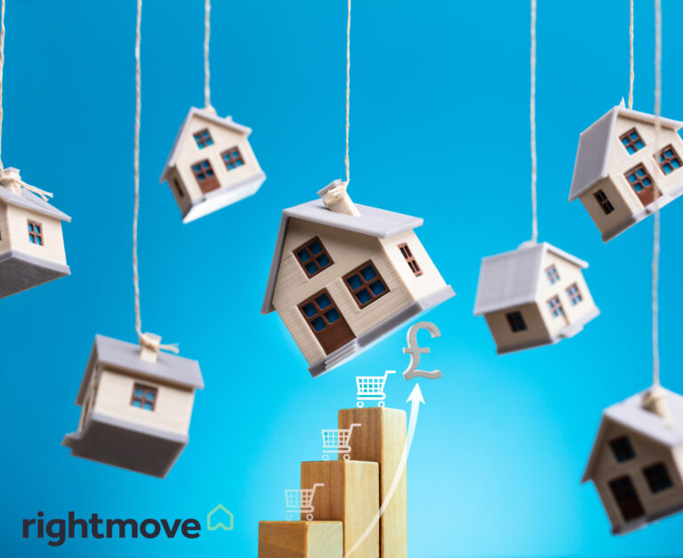 Model houses hanging on rope with a blue background, Rightmove logo and stepping blocks with supermarket trolleys balancing on top