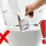 UK bank notes being put down the toilet, a red cross and an explanation mark