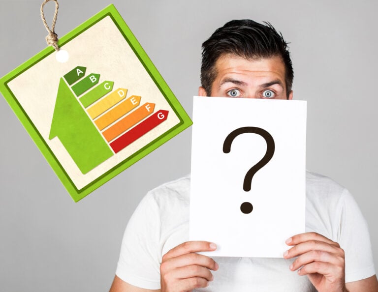 A person holding a question mark and an EPC graph hanging next to them