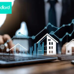 A person sitting at a desk with a digital image of homes and a graph increasing