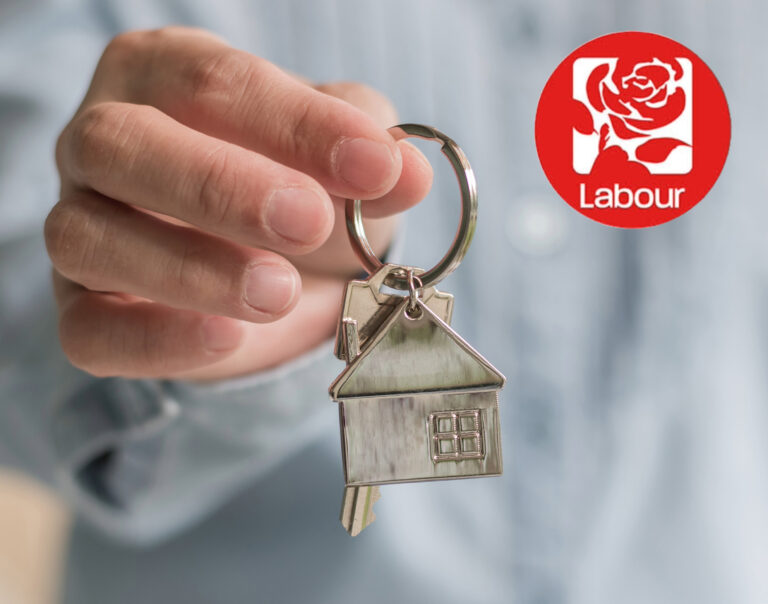 A person holding a keyring of a house