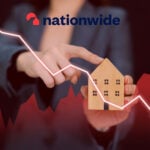 A person holding a house with an arrow pointing down