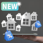 A group of small houses bouncing in the air with percentage signs and a sign saying new