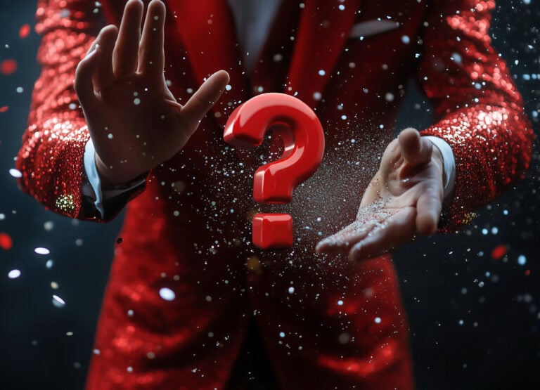 A person in a red suit with their hands placed in front of them and a red question mark