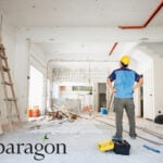 A construction worker inside a home being decorated