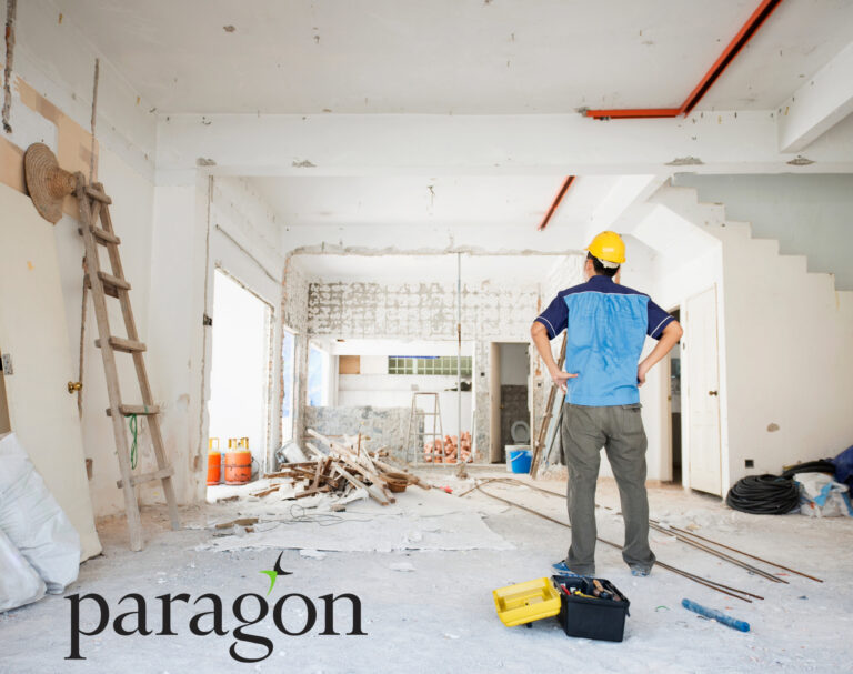 A construction worker inside a home being decorated