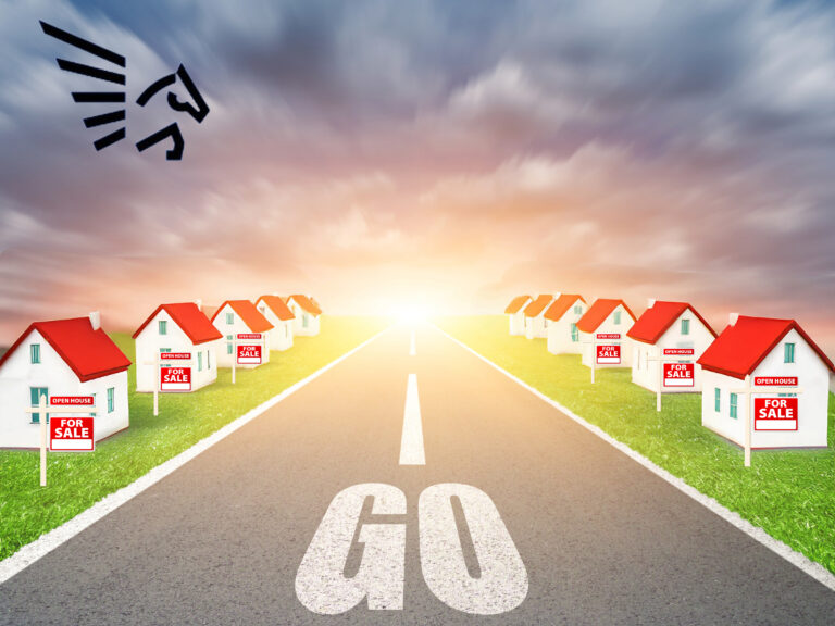 a model street of houses either side and a GO sign with a sunset in the background