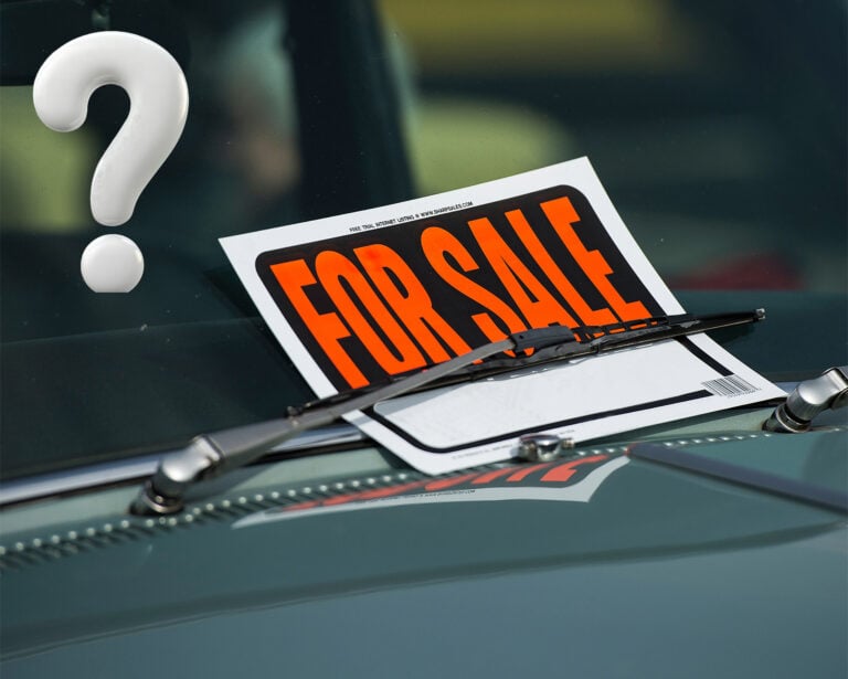 A fore sale sign and a question mark on a cars windscreen