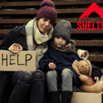 A mum and her son holding a help sign, Shelter logo