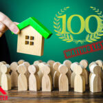 Wooden figure, a wooden house and 100 waiting list text on a green background